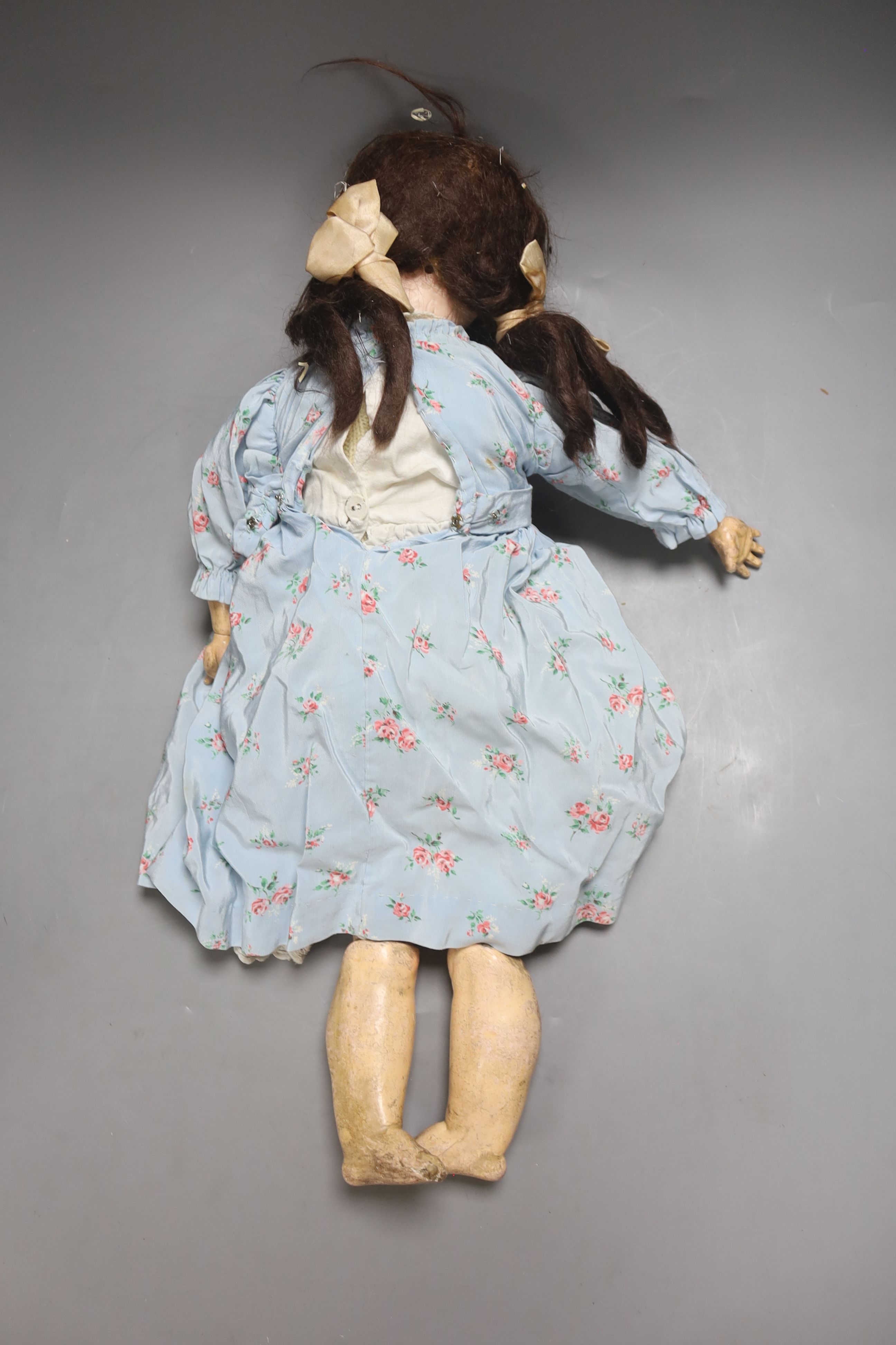 An A M 390 Bisque head doll, stamped AM, open mouth